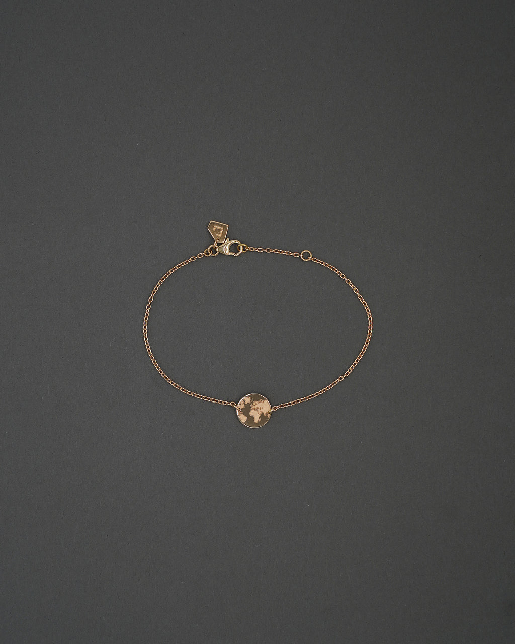 ONE WORLD ARMBAND MINI GULD
